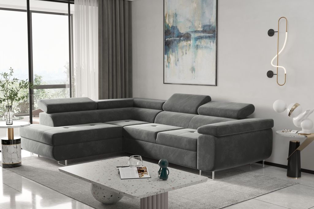 A modern living room with a large sectional sofa, coffee table, and artwork.