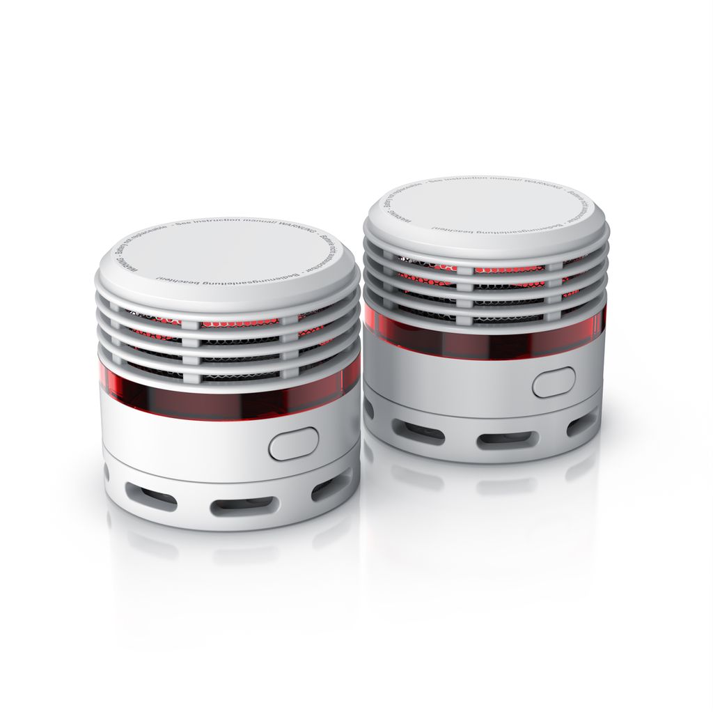 Two white smoke detectors with red accents are displayed against a white background.