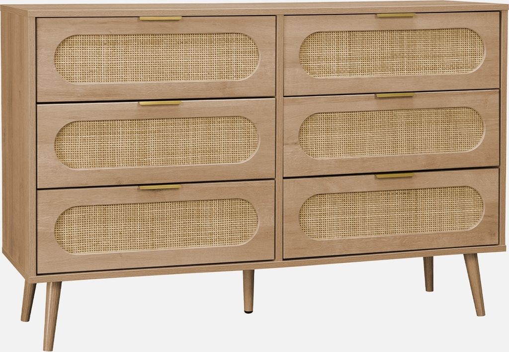 A front view of a wooden dresser with rattan drawer fronts.