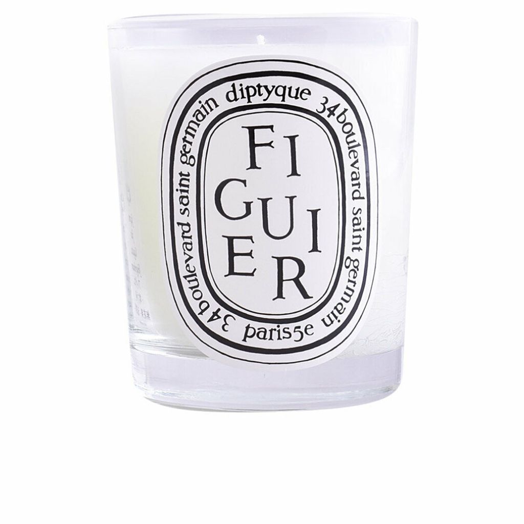 A close-up studio shot of a Diptyque scented candle in a glass jar.