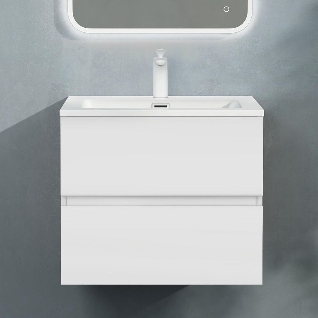 A white bathroom vanity with a sink and faucet against a gray textured wall.