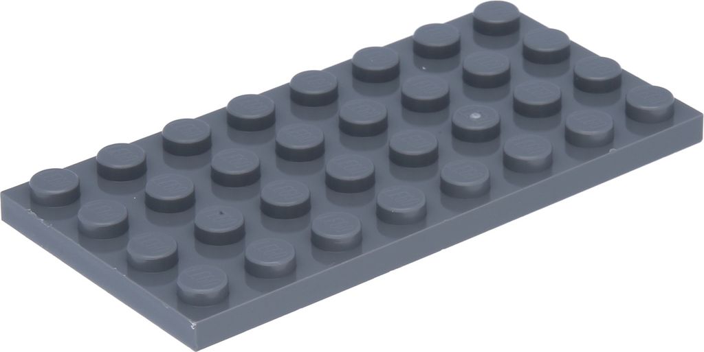 A dark gray LEGO brick plate with studs is shown from a slightly elevated angle against a white background.