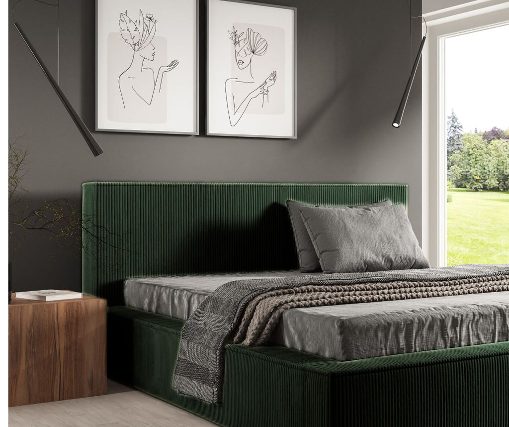 A bedroom scene with a bed, nightstand, and artwork on the wall.