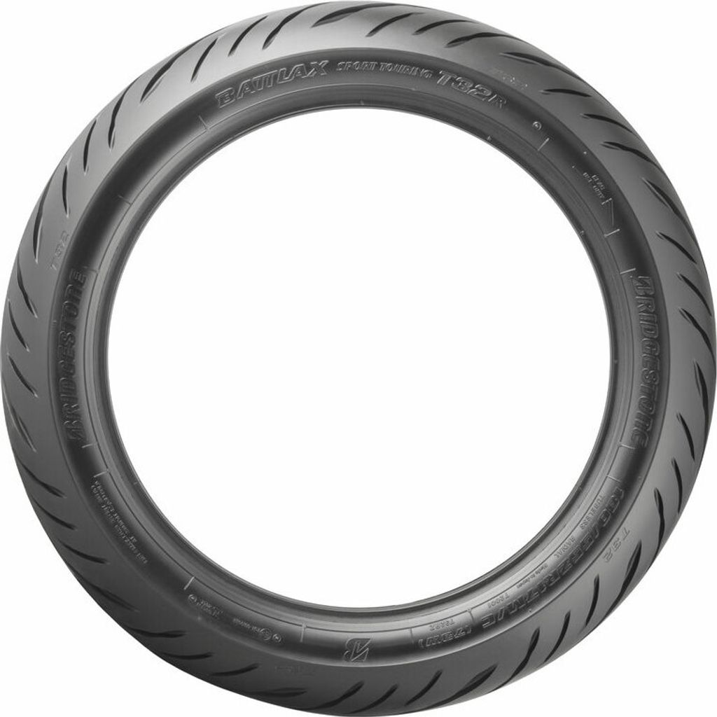 A motorcycle tire shown in a studio setting against a white background.