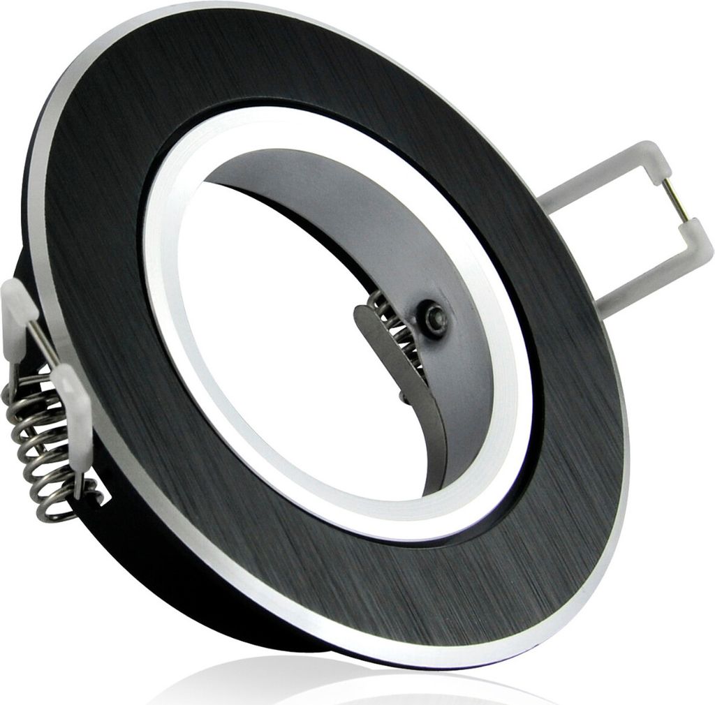 A close-up studio shot of a black and silver recessed light fixture with springs for installation.