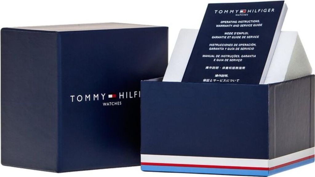 A Tommy Hilfiger watch box and its contents, including an instruction manual.