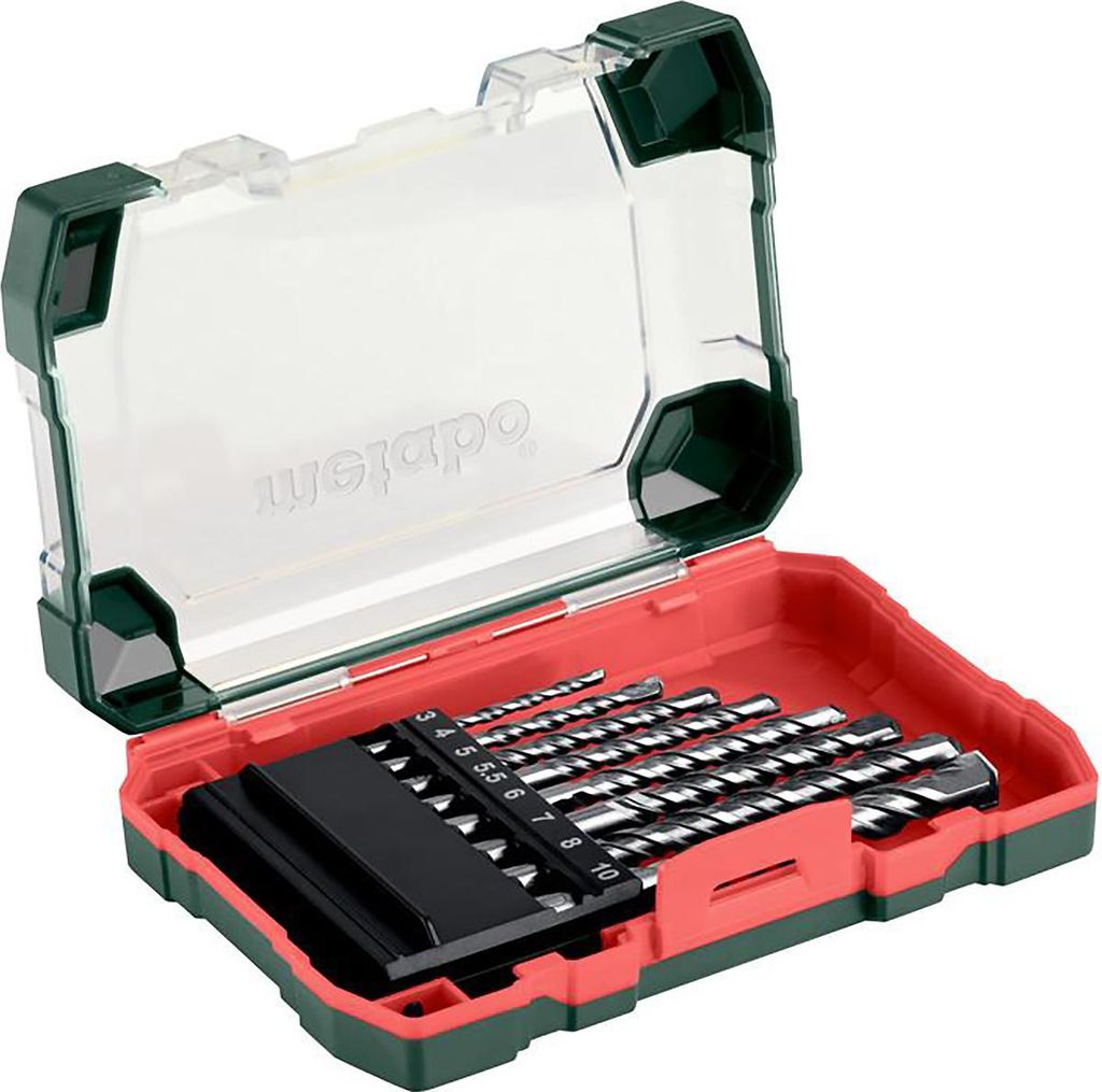 A set of drill bits in a red and green case.