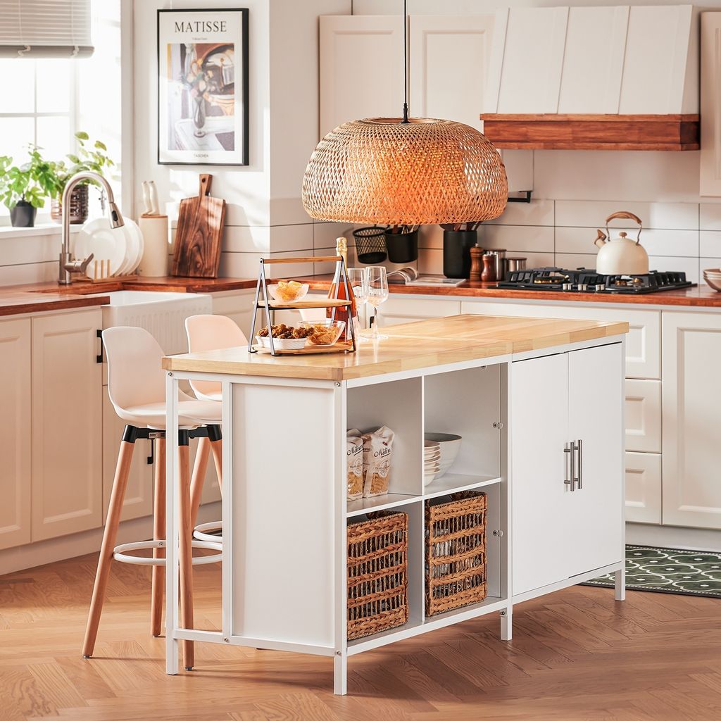 A modern kitchen with a white and natural wood kitchen island, bar stools, and various kitchen items.