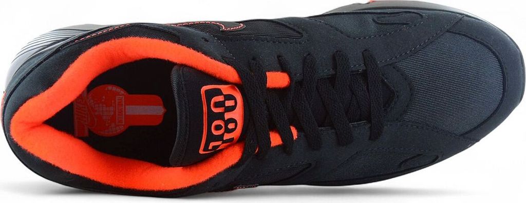 A top-down view of a black and orange Nike Air Max 180 sneaker against a white background.