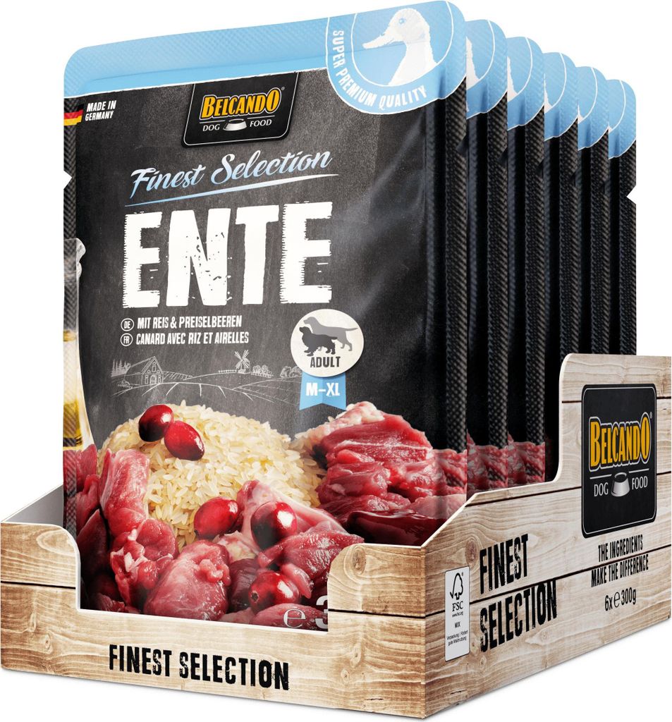 A display box of dog food pouches, with one pouch prominently shown in the foreground.
