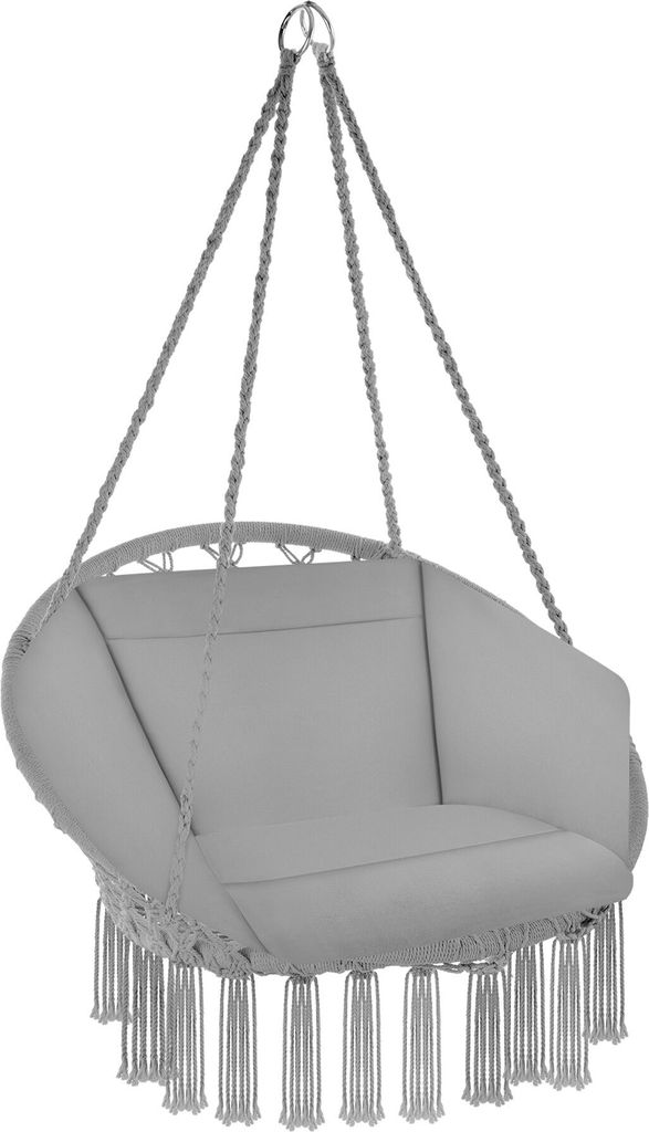 A hanging chair with macrame fringe detail.