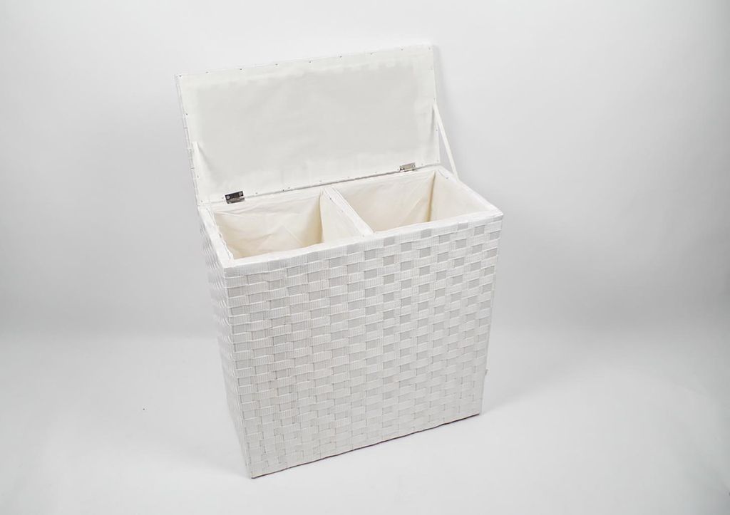 A white, woven laundry hamper with two compartments and an open lid, set against a white background.