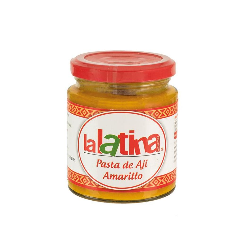A jar of yellow chili paste with a red lid.