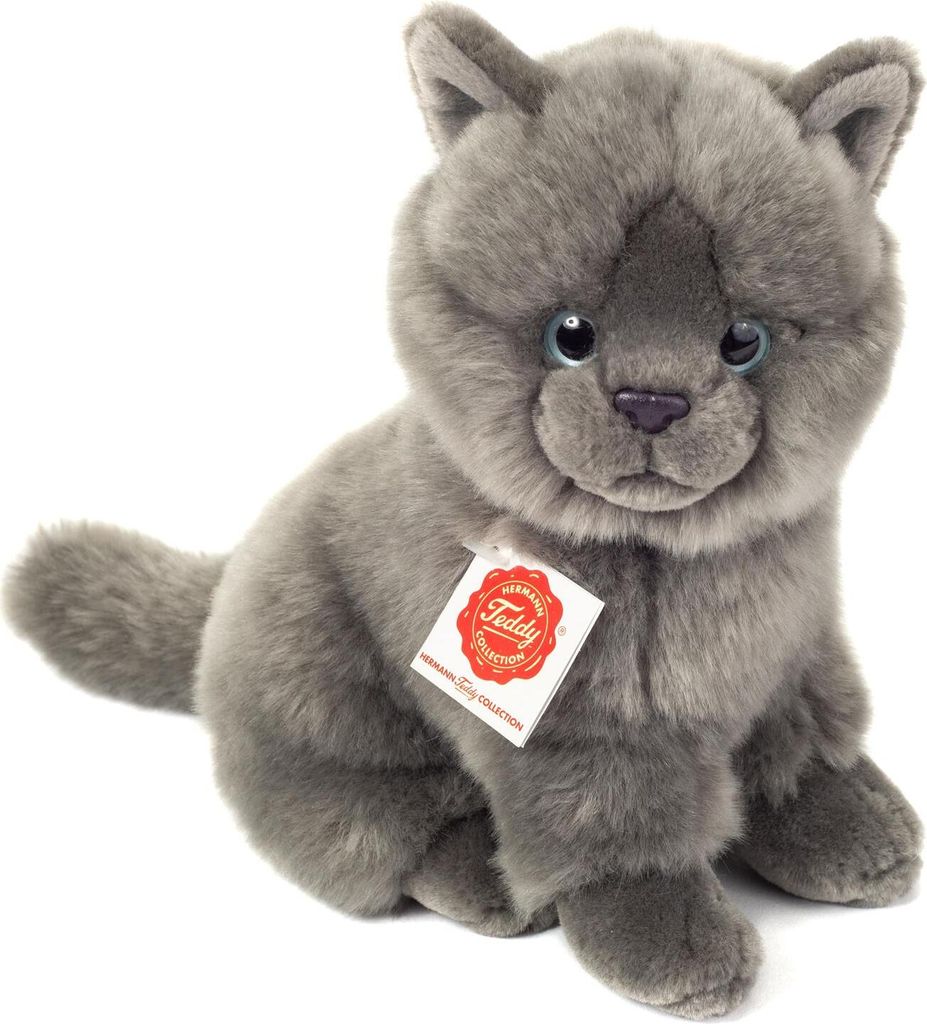 A plush toy cat sitting on a white background.