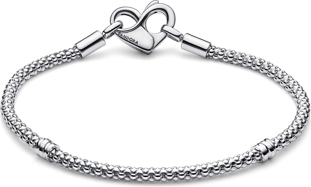 A silver Pandora bracelet with a heart-shaped clasp is displayed against a white background.