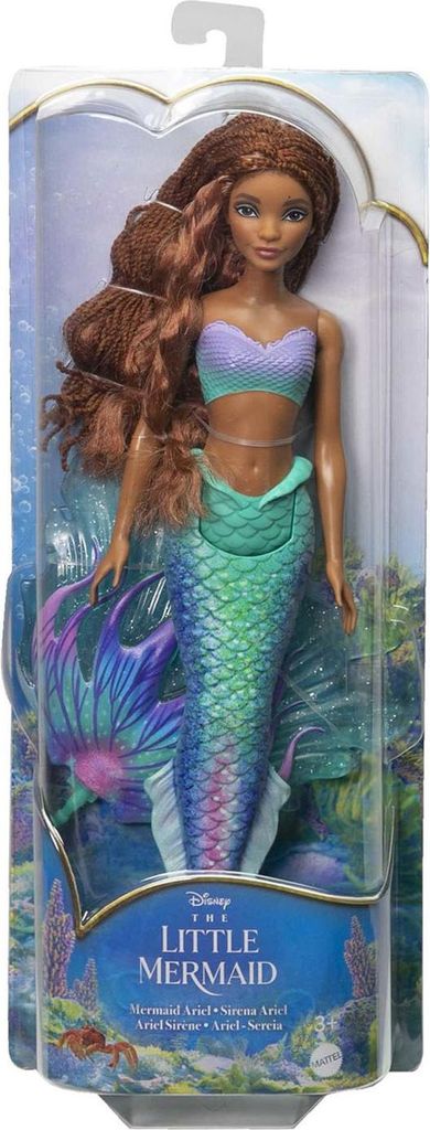 A doll in its packaging, designed to look like a mermaid.