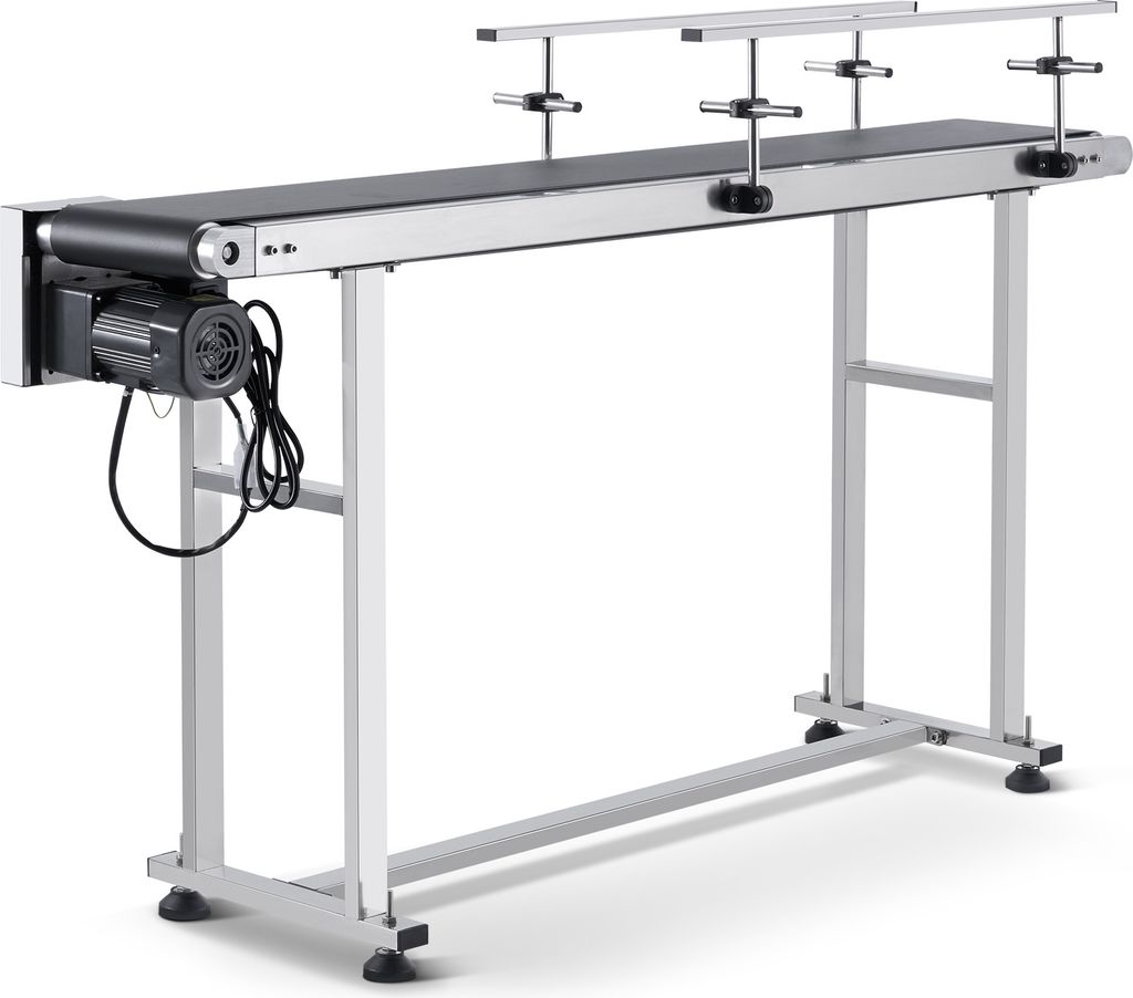 A long, silver conveyor belt system with a black belt, supported by a metal frame, is shown against a white background. A black motor is attached to the left end of the conveyor belt.