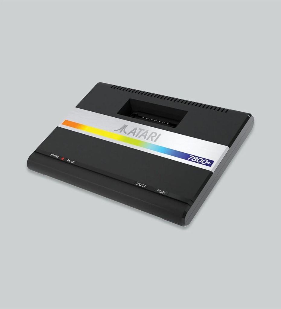 A product shot of a retro Atari 7800+ game console on a plain background.