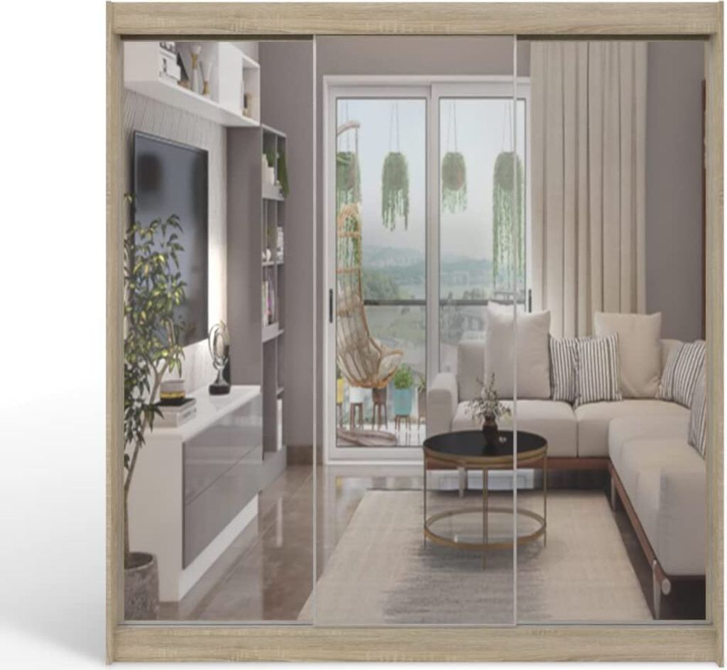 A modern living room with a sectional sofa, coffee table, and a large window overlooking a scenic view.