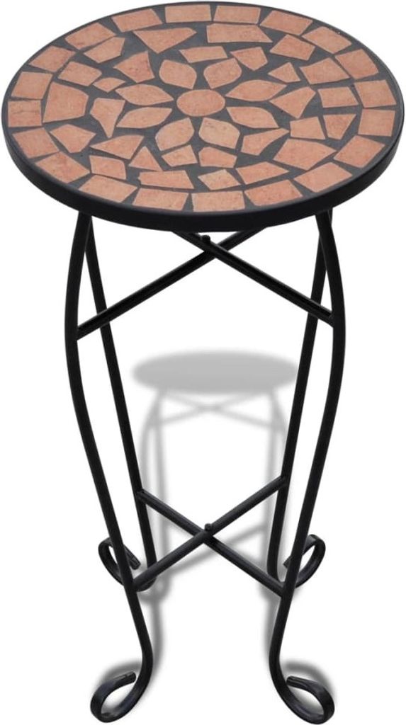 A round mosaic table with a black metal stand.