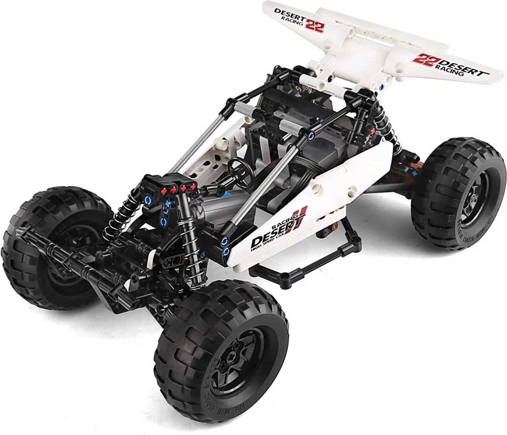 A white and black remote-controlled desert racing buggy, shown from a three-quarter front angle on a white background.