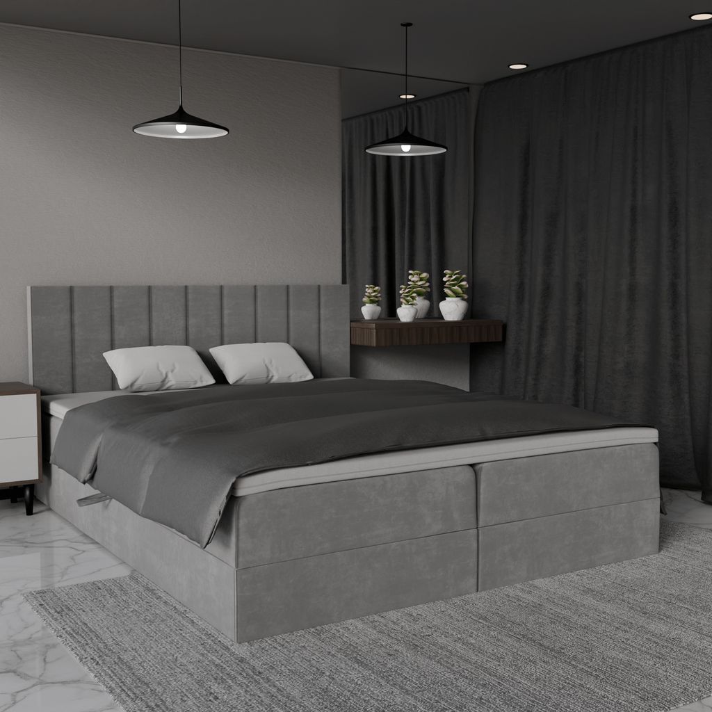 A modern bedroom with a large grey upholstered bed.