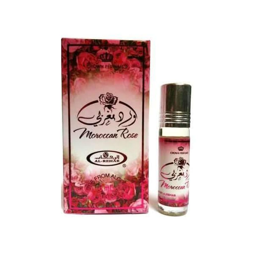 A product shot of a perfume bottle and its box, both featuring rose imagery and branding.