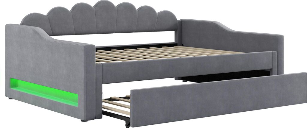 A gray upholstered daybed with a pull-out trundle bed, featuring green LED lighting on the side.