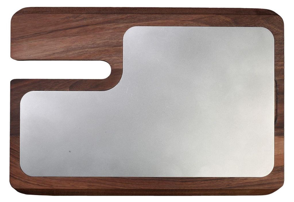 A cutting board with a metal insert.