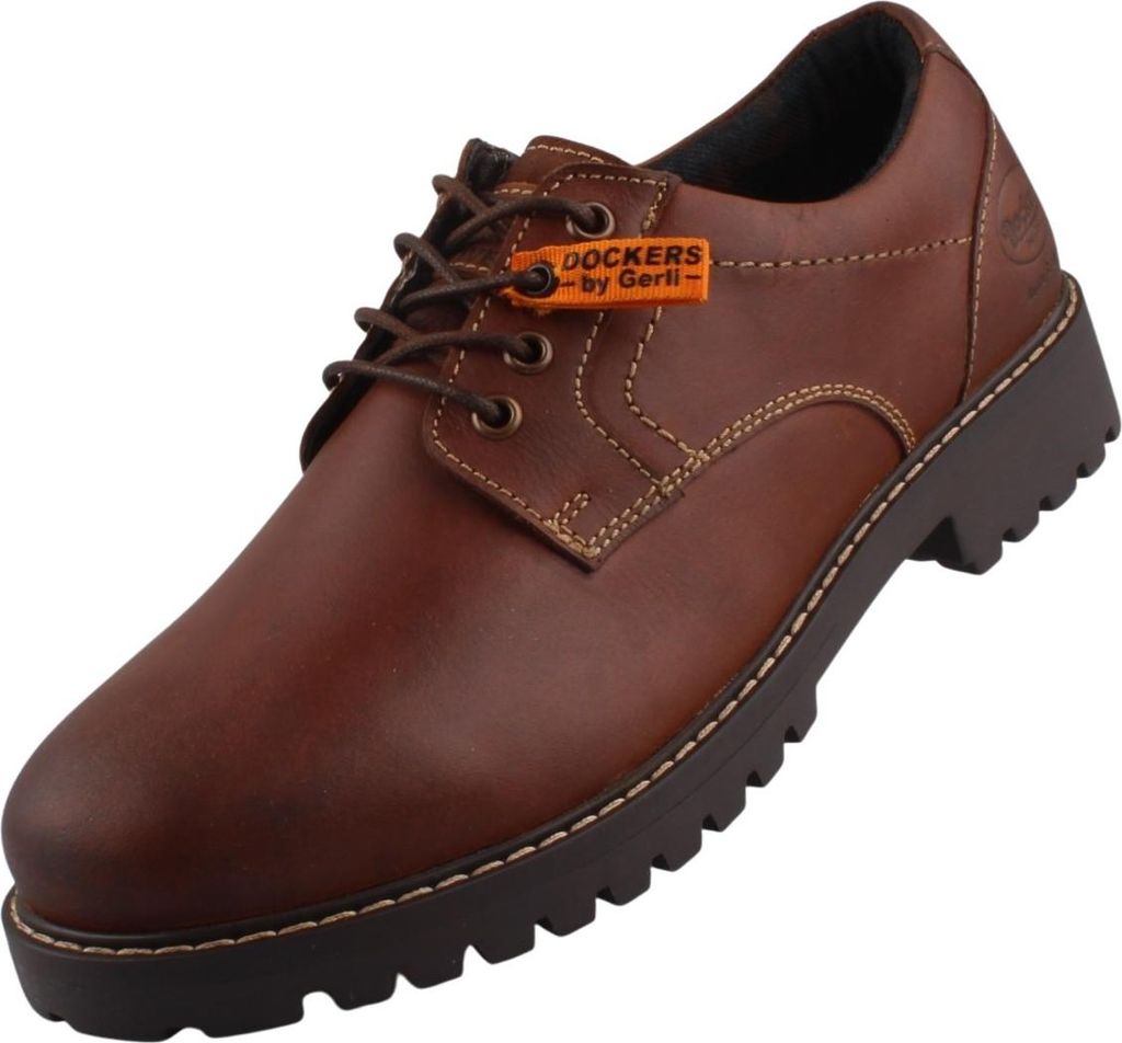 Auf dem Bild ist ein brauner Freizeitschuh zu sehen der von der Seite betrachtet wird. Der Schuh hat eine sportliche Form und zeigt ein minimalistisches Design.