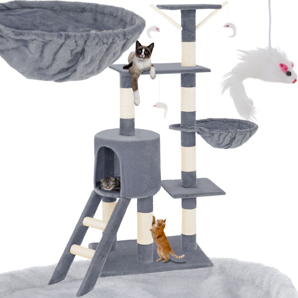 A multi-level cat tree with various platforms, scratching posts, a hammock, a hideaway cubby, and attached toys, with three cats interacting with it.