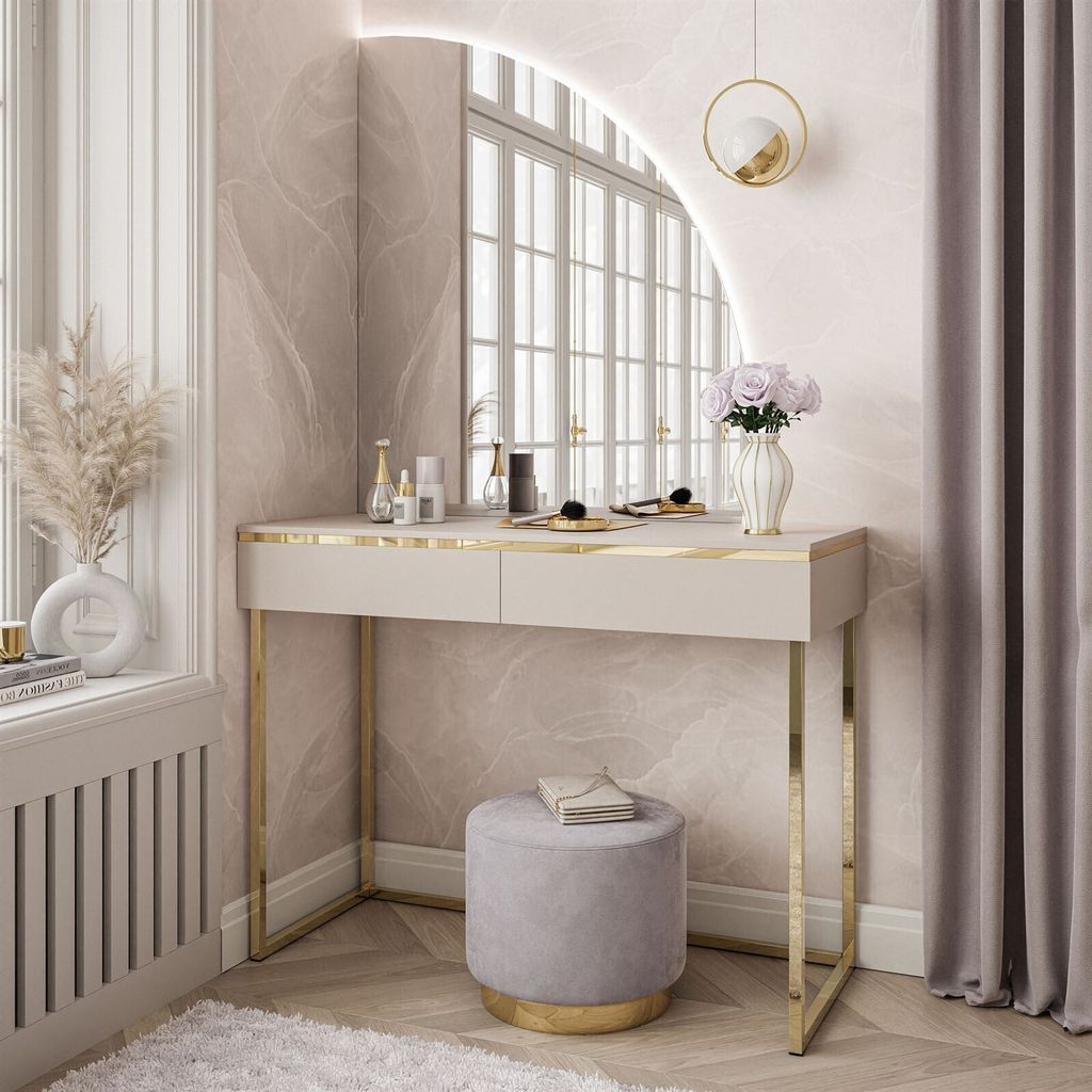 A modern vanity table with a mirror and stool in a well-lit room.