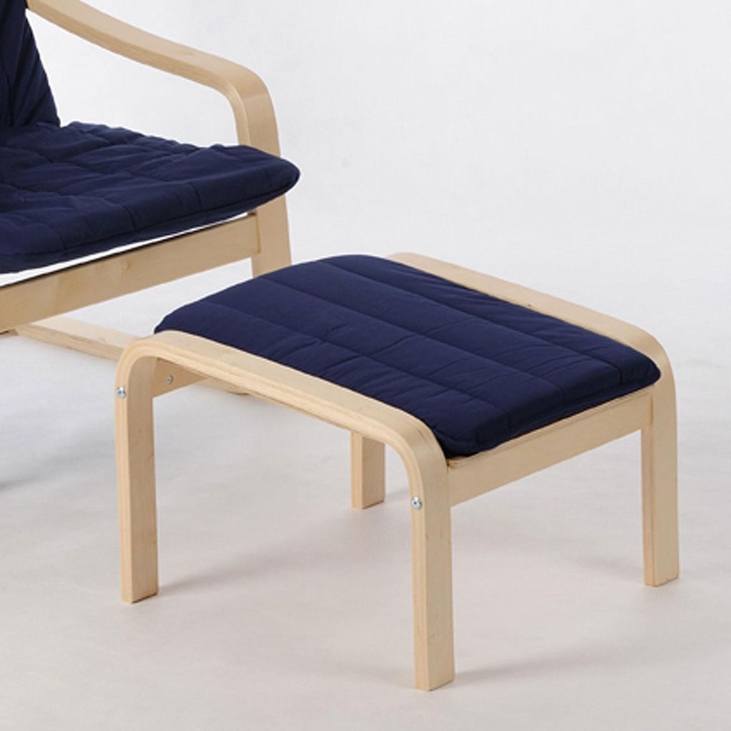 A close-up shot of a wooden ottoman with a blue cushion.