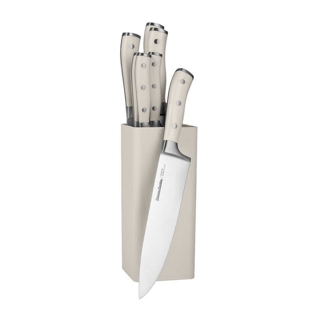 A set of kitchen knives in a block.