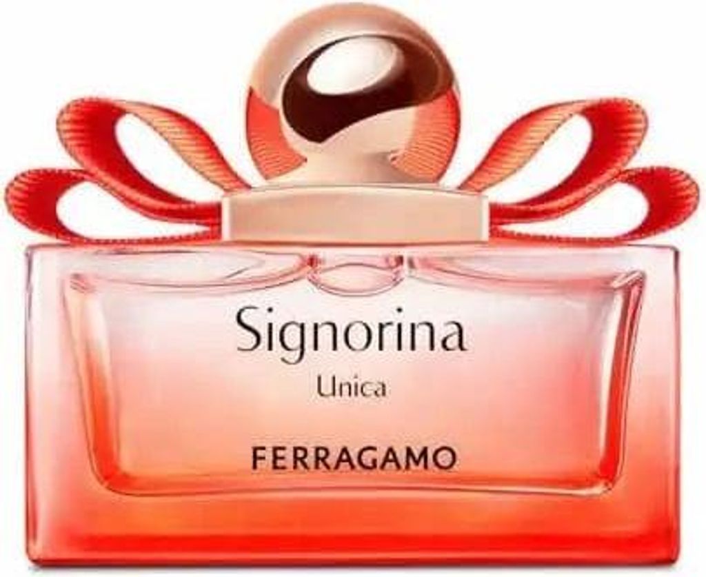 A perfume bottle with a red ribbon detail.