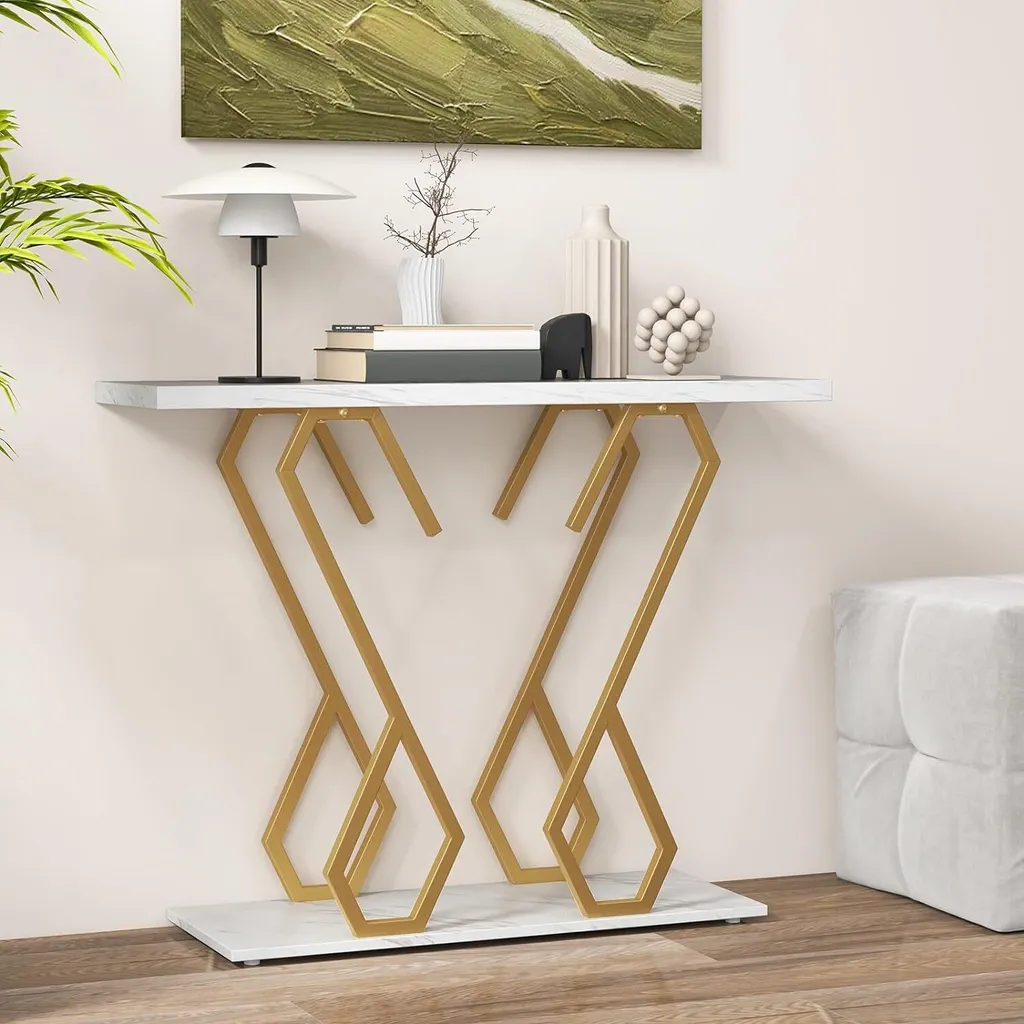 Console design marbre et or avec piètement métallique forme papillon