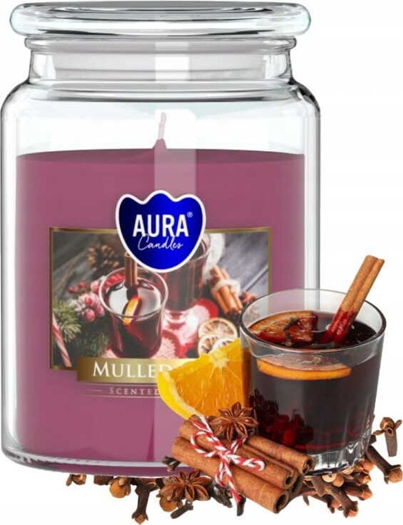 A large scented candle in a glass jar with a label depicting mulled wine and spices, with a glass of mulled wine and spices in the foreground.