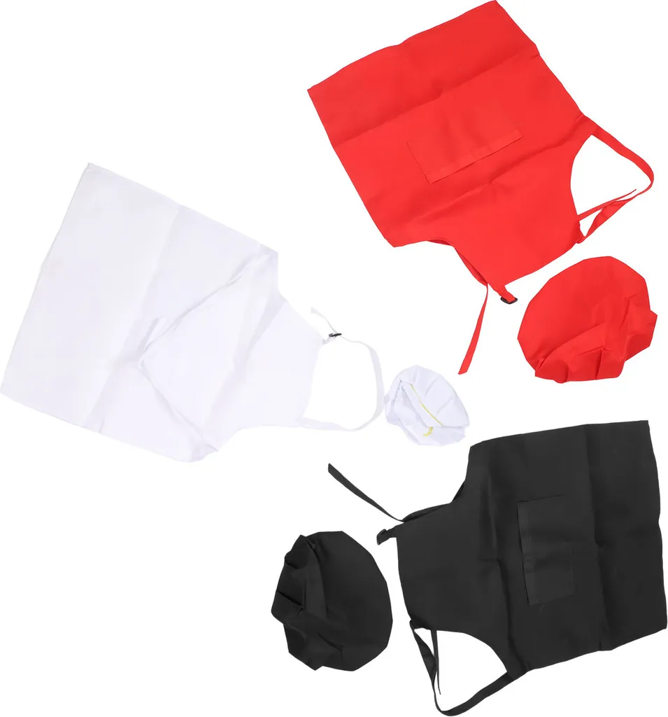 Bambini in Cappelli Del Cuoco Unico E Grembiuli Che Sbattono Le Uova in
