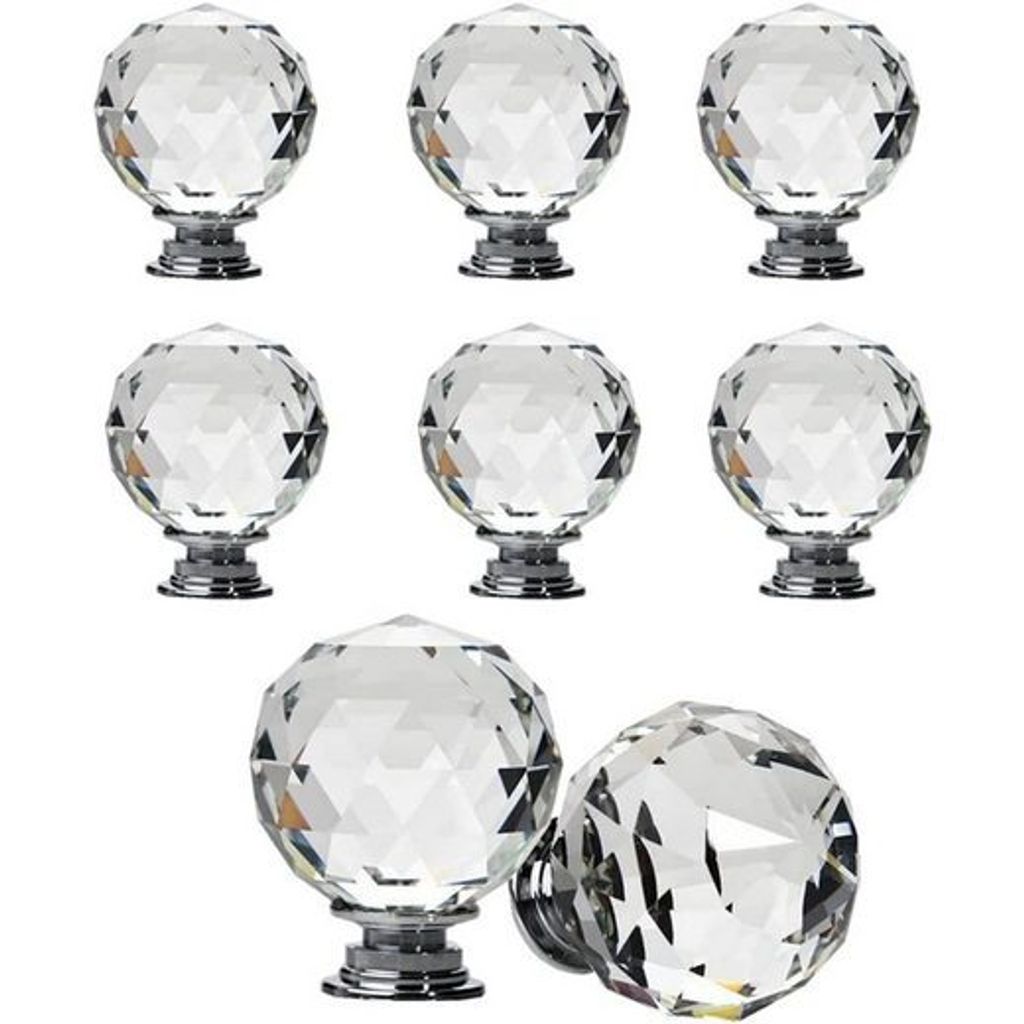 A collection of crystal cabinet knobs on a white background.