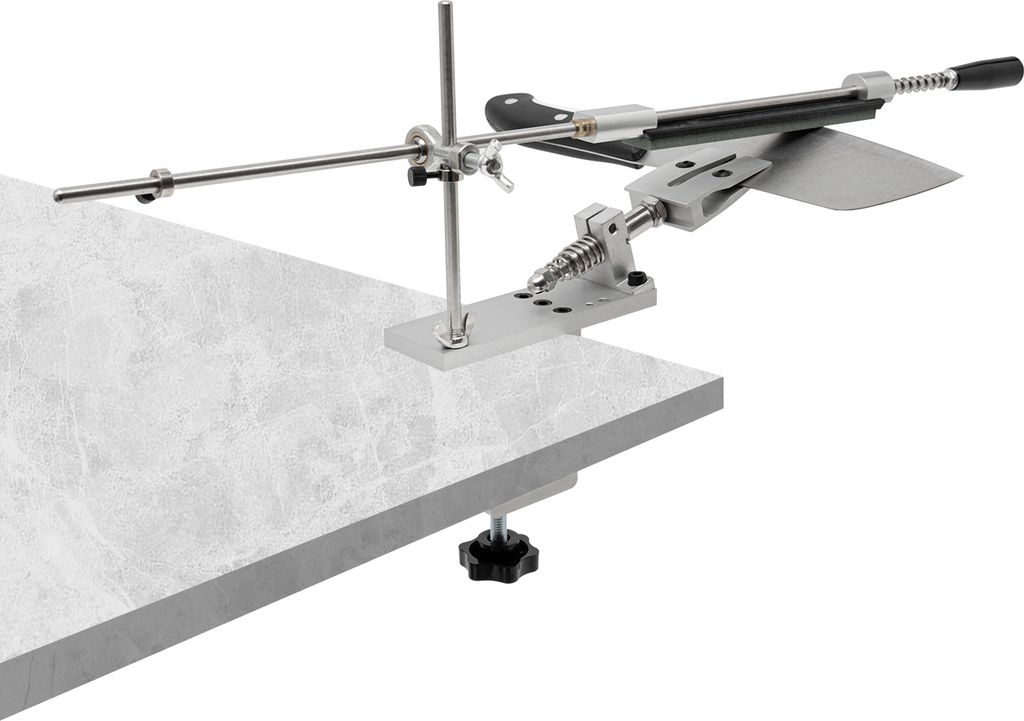 A knife sharpening system clamped to the edge of a countertop.