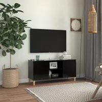 vidaXL TV skrinka s nohami z masívneho dreva čierna 103,5x35x50 cm