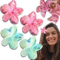 Ein Set mit 4 Haarspangen mit bunten Plumeriablüten