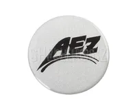 Středový samolepicí emblem průměr 60 mm logo AEZ, měkký plast, stříbrný