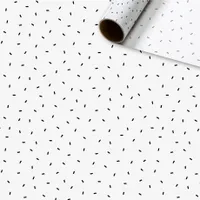 Seidenpapier in einer Rolle mit schwarzem Konfetti