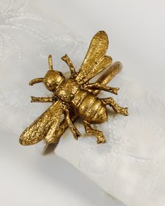 Goldener Serviettenring mit Bienen Motiv