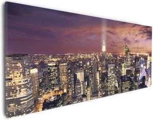 Wallario Premium Leinwandbild New York bei Nacht - Panoramablick über die Stadt in Größe 30 x 75 cm