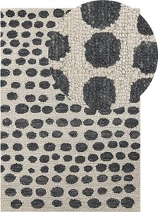 BELIANI Dywan beżowo-czarny wełniany 140 x 200 cm ręcznie wykonany wzór w kropki w stylu boho do salonu sypialni