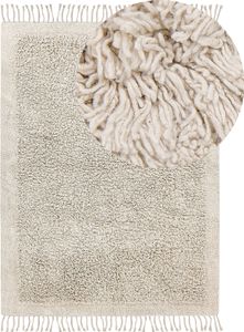 BELIANI Teppich Hellbeige Baumwolle Rechteckig 140 x 200 cm mit Fransen Getuftet Boho Langhaar Hochflor Shaggy Bettvorleger Läufer für Fußbodenheizung