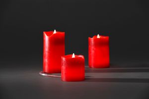 Konstsmide - LED Echtwachskerzen 3er-Set, rot, zerlaufene Wachsoptik, 6, 5 - 12, 5 cm, 6 warm weiß flackernde Dioden, 3V Innentrafo, transparentes Kabel ; 1968-550