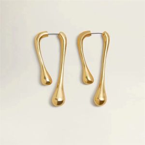 Elegante Lavasohrringe - Goldfarbenes minimalistisches fließendes Design